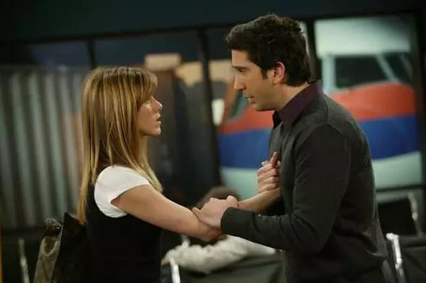 Ross stops Rachel at the airport and she gets off her plane 