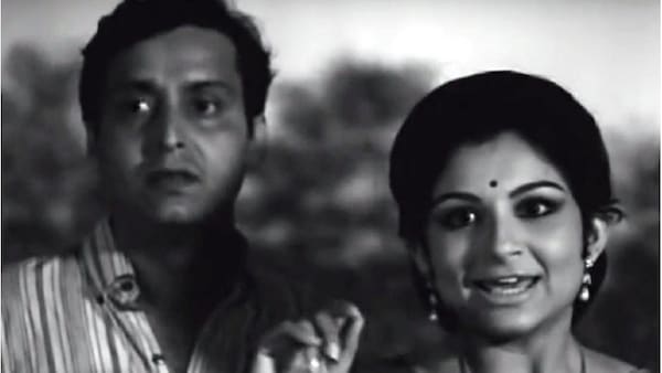 Soumitra Chatterjee and Sharmila Tagore in a still from Aranyer Din Ratri