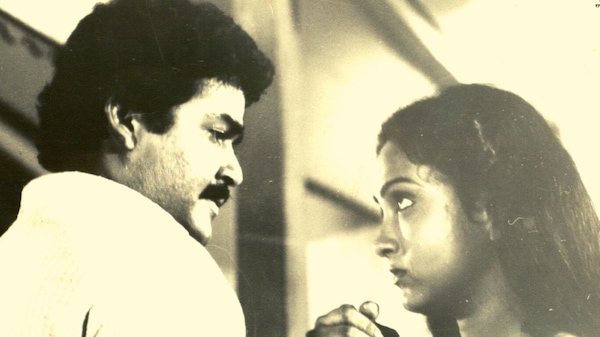 Mohanlal as Solomon and Shari as Sofia in Namukku Parkkan Munthiri Thoppukal