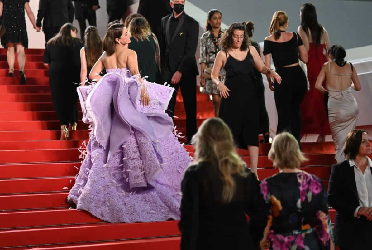 The splendid dress was packed with tiny feather works all over.