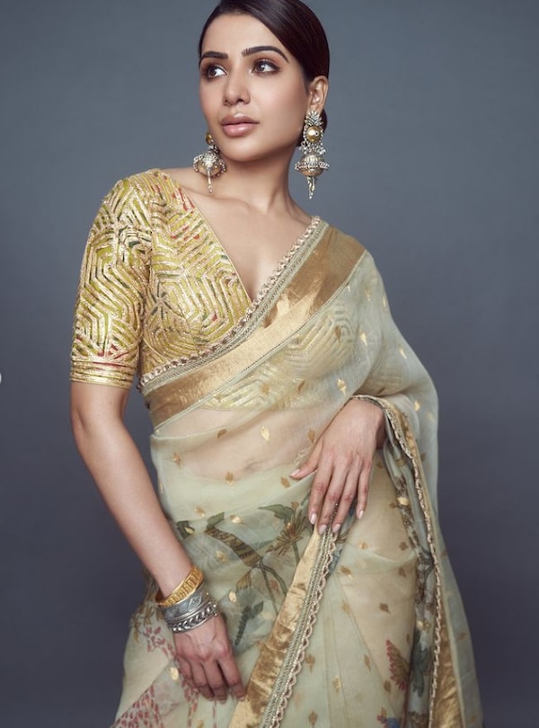 Samantha flaunted her beauty in a golden saree. She shared her gorgeous pics on Instagram and captioned, "In love with this hand painted saree (sic)."