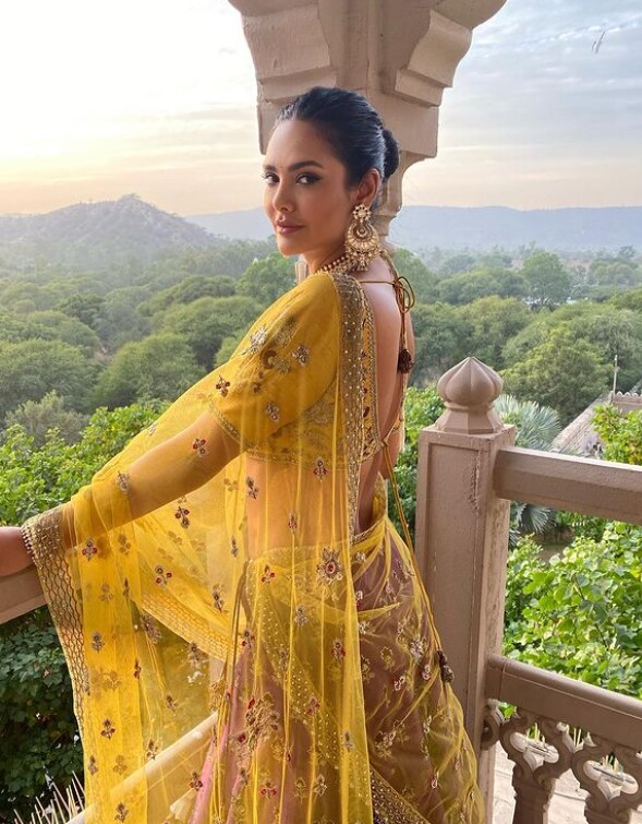 Esha's stunning attire with a backless blouse redefines sexy traditional looks.