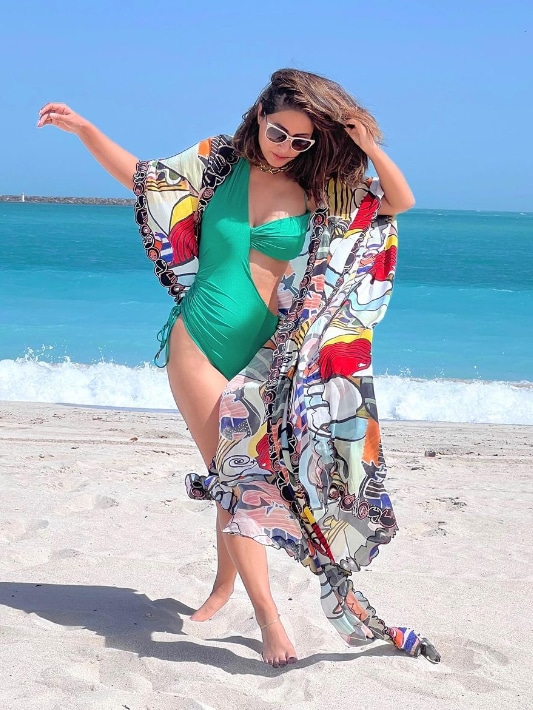 Hina's sexy green monokini is an inspiration for fashionable beach wears.