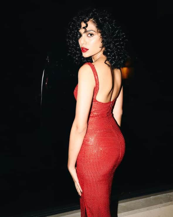 Here, the Kurup actress was spotted in a sexy fit red dress with a curly hairdo, at an event for Amazon Prime Video.