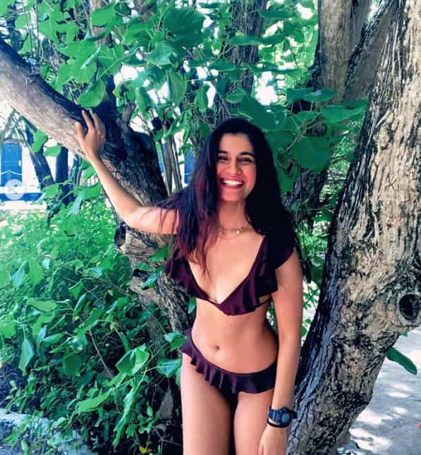 The smile in a sultry brown two-piece bikini makes the actress look cute and alluring at the same time.