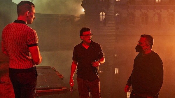 The Russo Brothers on the set of The Gray Man with Chris Evans