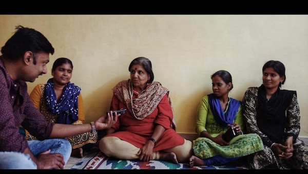 Vasanth Adithya interviewing activist Geetha Menon
