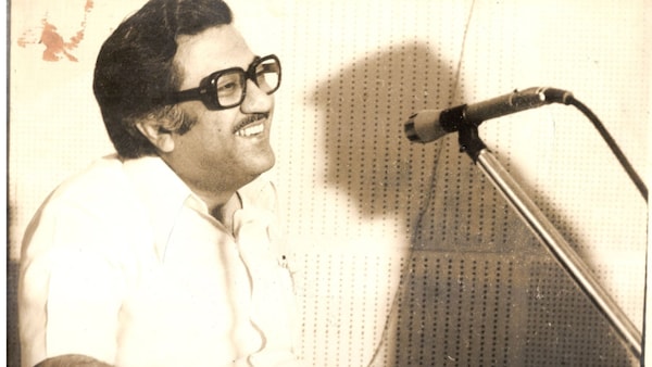 Ameen Sayani at the mic recording a programme