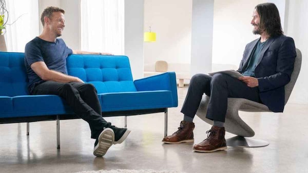 Keanu Reeves (right) with Jenson Button (left)