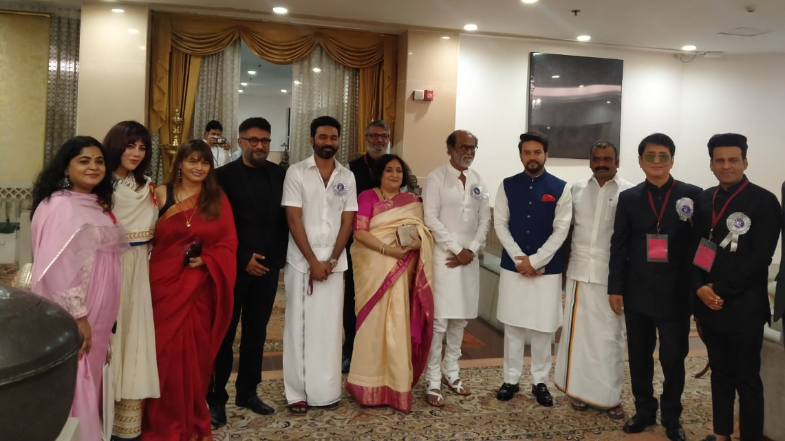 Rajinikanth and Dhanush with others at the event