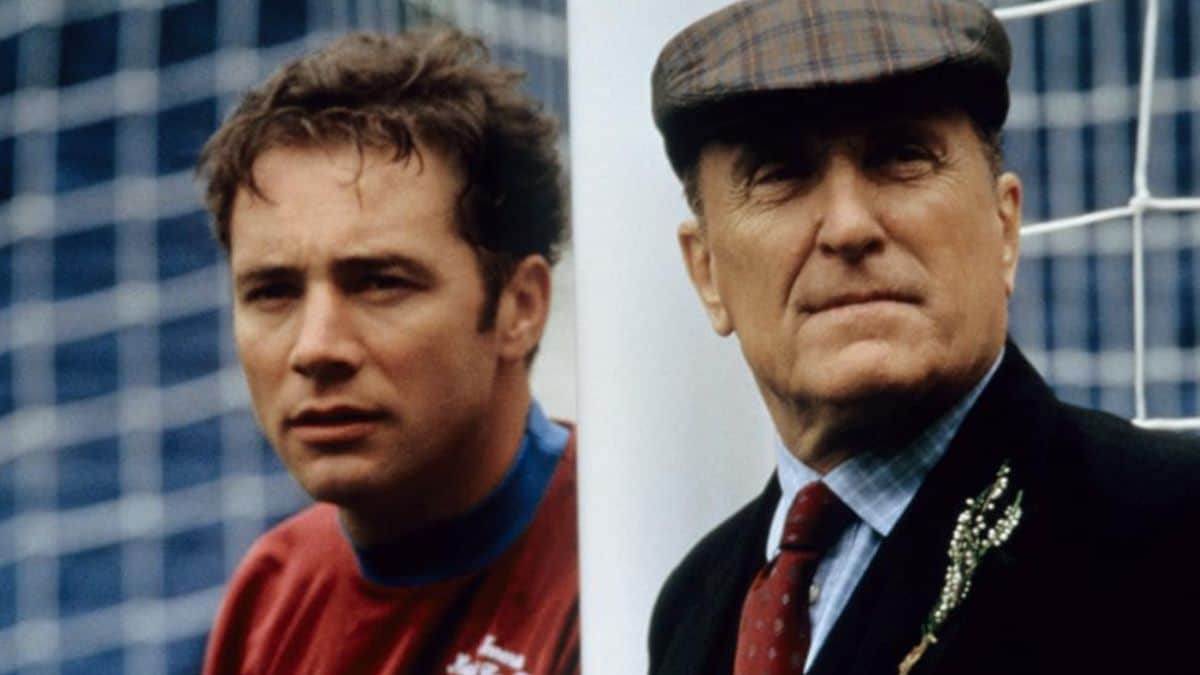 In which Michael Keaton movie, does he play the role of a US-based owner of a Scottish football team whose manager is under pressure to show results?