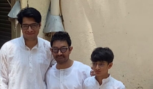 WATCH- Aamir Khan distributing sweets to paps and fans with his sons Junaid and Azad on the occasion of Eid