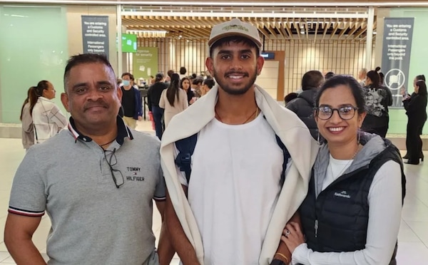 Adithya Ashok with his parents. Image | RNZ