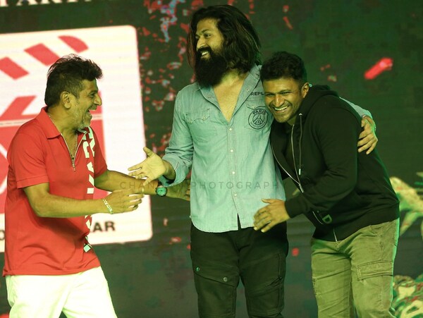 Chandan's click of Shivarajkumar, Yash and Puneeth at the Bhajarangi 2 pre-release event, two days prior to the Power Star's demise