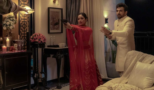 Yami Gautam Dhar and Pratik Gandhi in a still from Dhoom Dhaam
