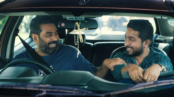 Biju Menon and Vineeth Sreenivasan in a still from Thankam