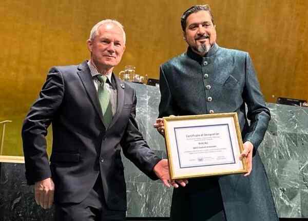 Ricky Kej receives the official United Nations Goodwill Ambassador plaque from His Excellency Csaba Kőrösi, the President of the United Nations General Assembly, at the UN Headquarters in New York