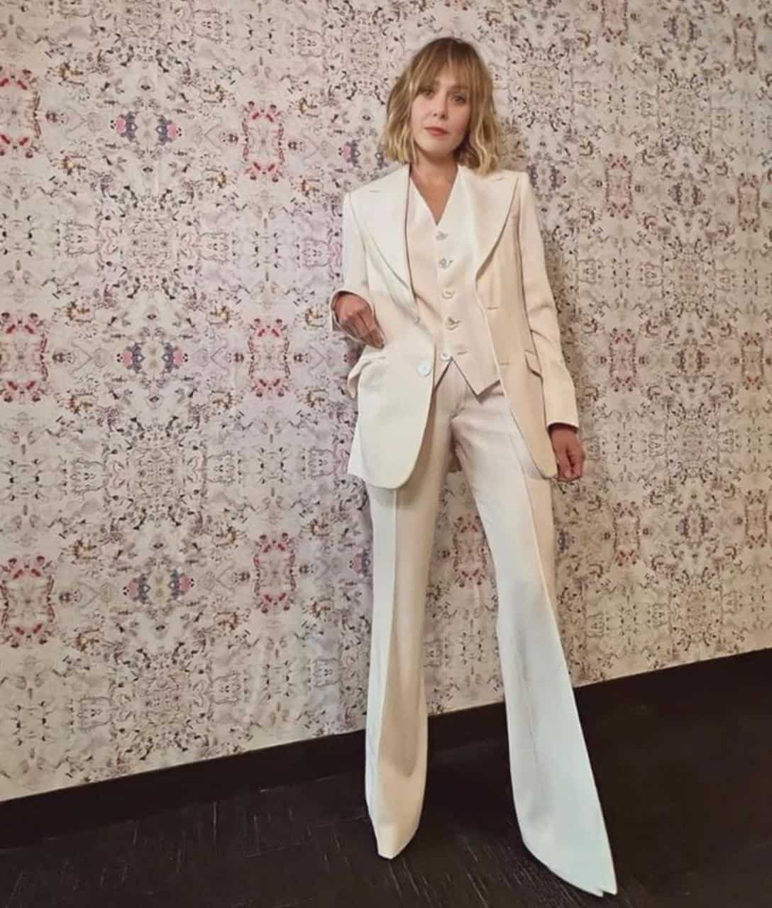 Elizabeth in an all-white suit