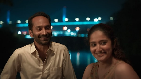 Fahadh Faasil and Anjana Jayaprakash in a still from Pachuvum Athbutha Vilakkum