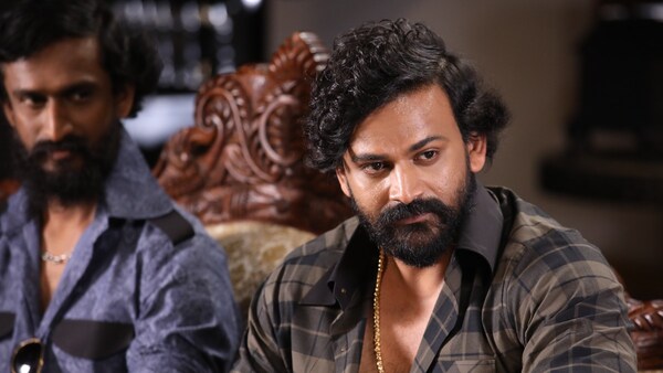 Balu Nagendra and Dhananjaya in a still from the film