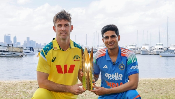 Mithcell Marsh and Shubman Gill posing with the trophy before the start of the series. Image | BCCI on X
