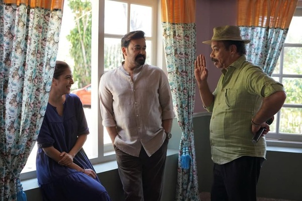 Malavika Mohanan with Mohanlal and Sathyan Anthikkad on the set of Hridayapoorvam