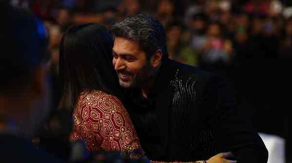 Jayam Ravi hugs Aishwarya Rai at PS 2 Hyderabad event