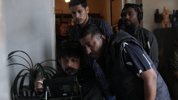 Jomon T John and Vineeth Sreenivasan on the sets of Karam