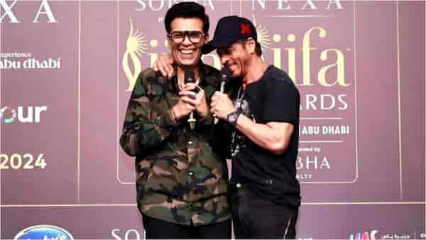 Karan Johar calls Shah Rukh Khan "family forever," drops new candid clicks