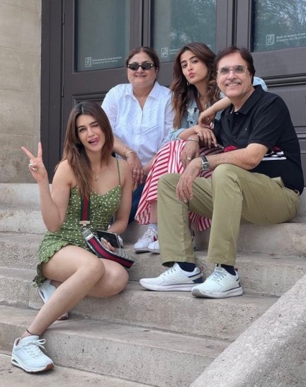 Kriti poses for a family picture