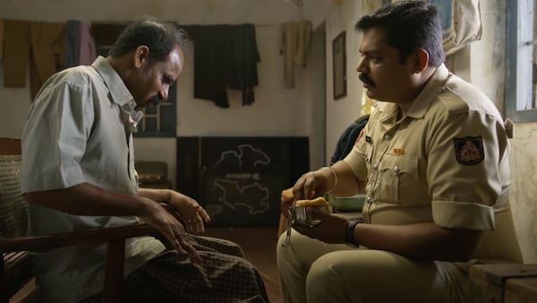 Pramod Shetty (right) in a still from Laughing Buddha