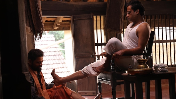 Praveen Tej and Gopalkrishna Deshpande in a still from Maarigallu