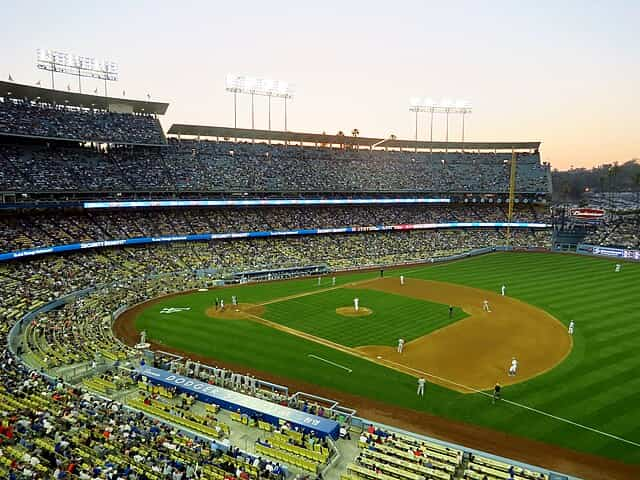 Bryan Cranston's wife threw him a surprise birthday party at which famous baseball stadium as he was a huge fan of the sport?	