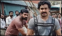https://images.ottplay.com/images/mohanlal-vijay-sethupathi-in-thudarum-1765436454.jpg