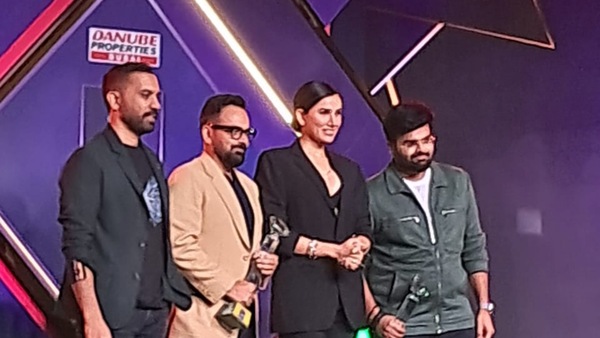 Raj and DK receive the award.