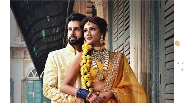 Sauraseni Maitra and Nikhil Jain pose as bride and groom