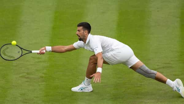 Novak Djokovic at full stretch during his Wimbledon round 1 match