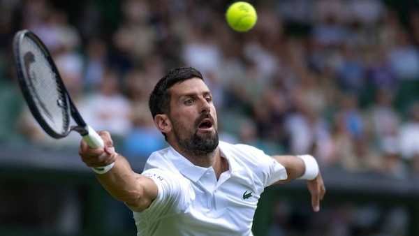 Novak Djokovic reached his record 14th Wimbledon semi final.