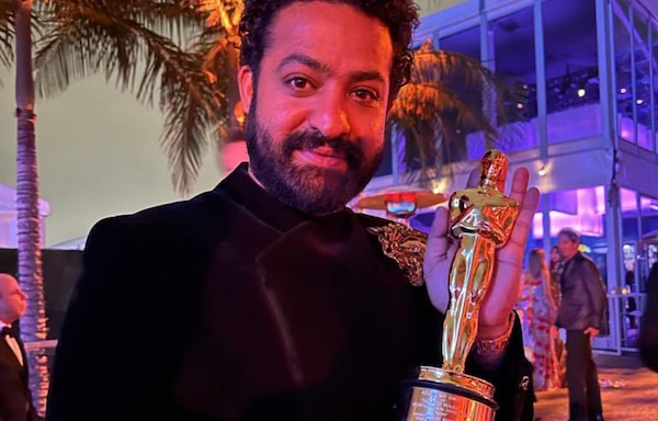 A super thrilled NTR poses with the Oscar Award, wishes team RRR and India