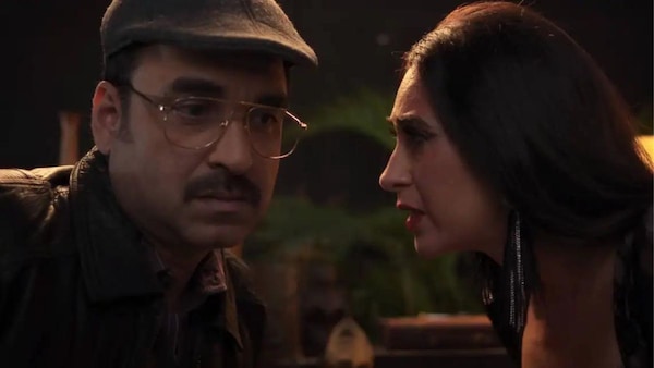 Pankaj Tripathi and Karisma Kapoor in a still from Murder Mubarak.