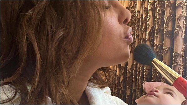 Too cute to handle! Priyanka Chopra's baby girl, Malti Marie, cannot take her eyes off her mom as she gets her makeup done
