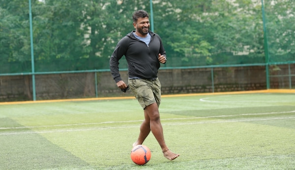 Puneeth playing football with family captured by Chandan