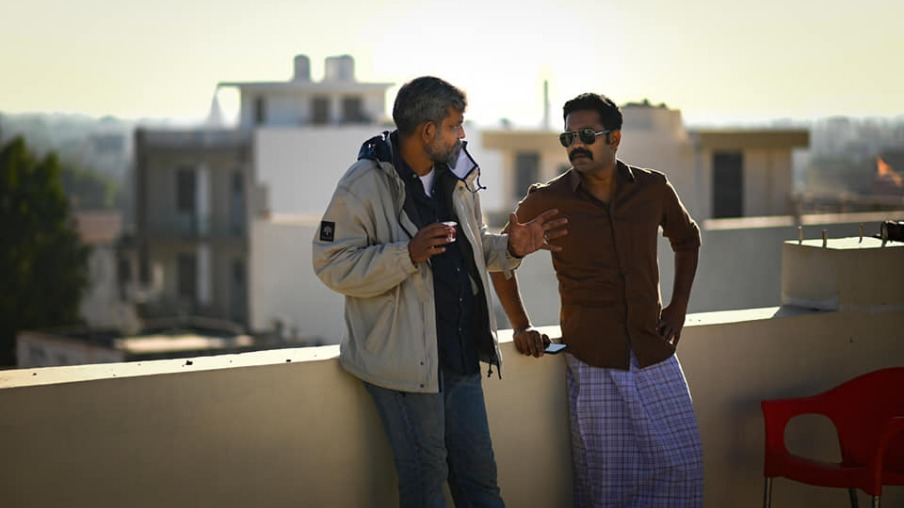 Rajeev Ravi and Asif Ali on the sets of Kuttavum Shikshayum