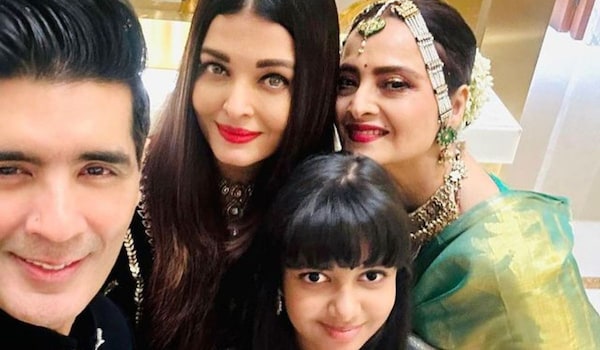 Rekha poses with Aishwarya Rai Bachchan and Aaradhya Bachchan