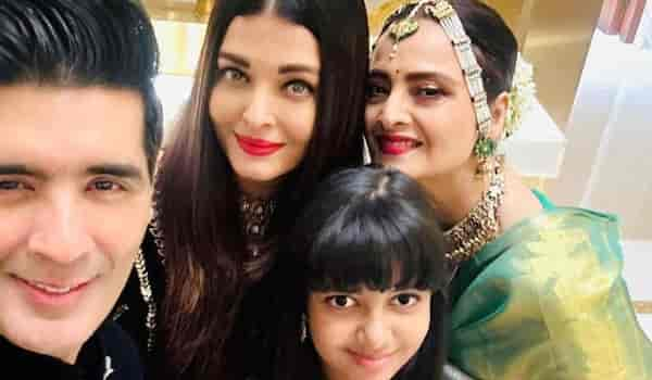 Rekha poses with Aishwarya Rai Bachchan and Aaradhya Bachchan