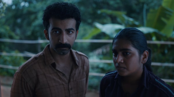 Roshan Mathew and Nimisha Sajayan in a still from Poacher