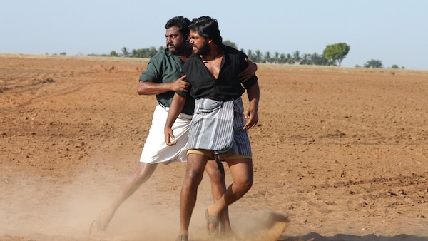 Saravanan and Karthi in a still from the film