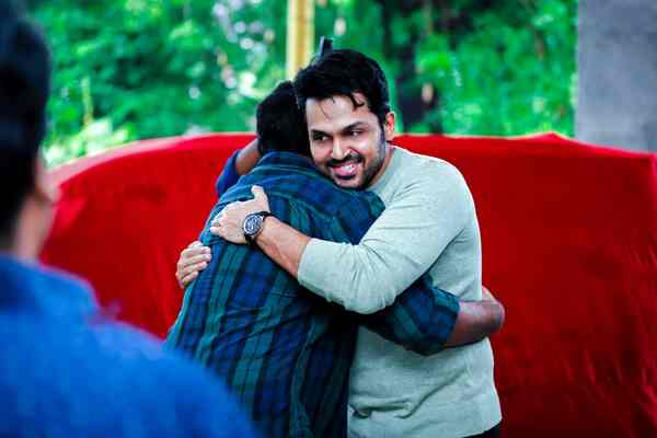 An excited Karthi seen hugging Mithran