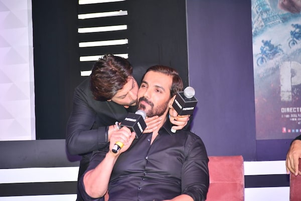 Shah Rukh Khan kisses John Abraham at Pathaan success event (Courtesy: Manav Manglani)