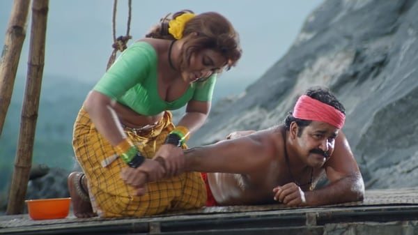 Silk Smitha and Mohanlal in a still from Spadikam